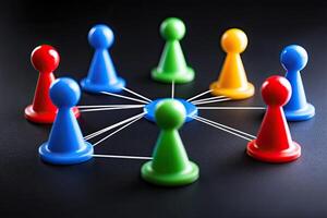 Colorful game pieces connected by threads, forming a network photo