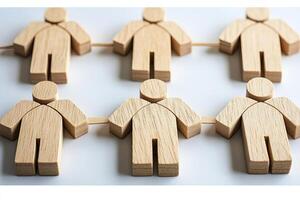Wooden figures linked together photo