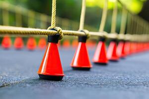 Outdoor play equipment. Rope and cones photo