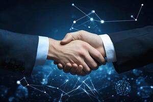 Businessmen shaking hands over networked background photo