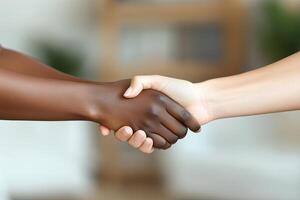 Two people shaking hands with each other photo