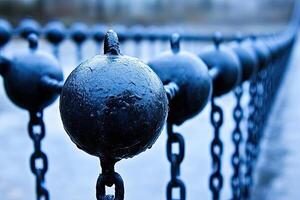 Dark metal spheres on chains photo