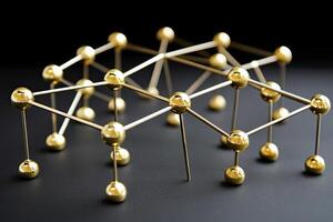 Golden spheres connected by metallic rods, forming a complex network photo