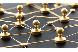 Gold pin connections on a dark background. Detailed network of linked golden pushpins photo