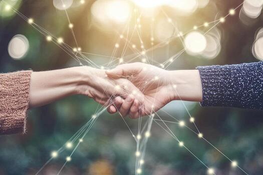 Two hands clasped in connection photo