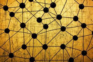 A black and gold background with many dots photo
