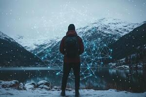 Contemplative figure amidst digital network, snow-capped mountains photo