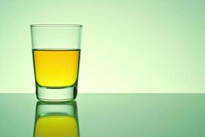 Empty shot glass with liquid photo