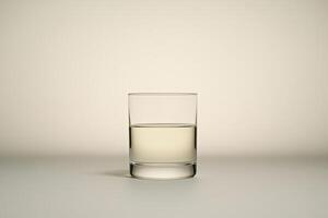 Empty glass half-full with liquid photo