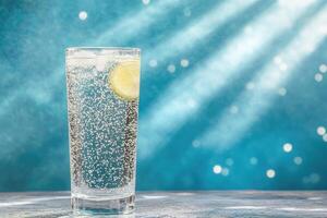 Refreshing glass of sparkling water with lime photo