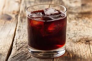 Dark, refreshing drink with ice photo