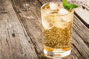 Refreshing iced drink on rustic wood photo