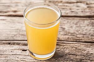 Light golden drink in glass photo