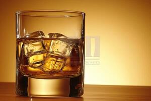 Whiskey with ice in a glass photo