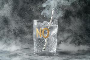 A glass of water with a straw in it with the word no written on it photo