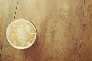 Refreshing drink on a wooden table photo