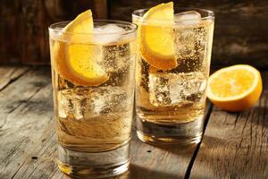 Refreshing, bubbly drinks garnished with citrus photo