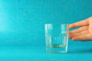 Empty glass being presented photo