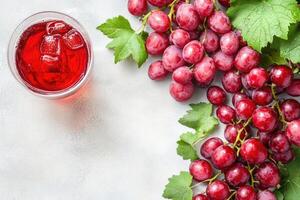 Fresh red grapes and juice photo