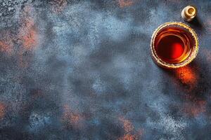 Cognac glass on dark surface photo