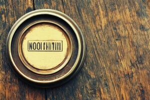Circular antique frame with stamped text photo