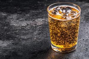 Refreshing, fizzy drink in a glass photo