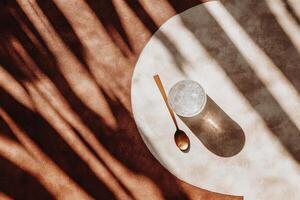 Tranquil, sun-drenched drink on a table photo