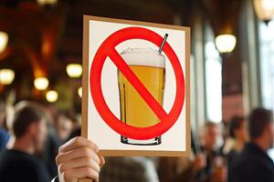 No alcohol sign held aloft photo