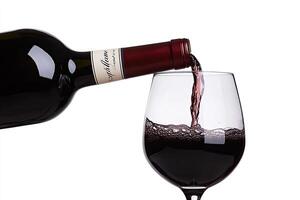 Pouring red wine into a glass photo