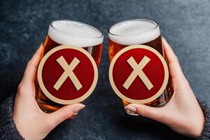 Two beer glasses with rejection symbols photo