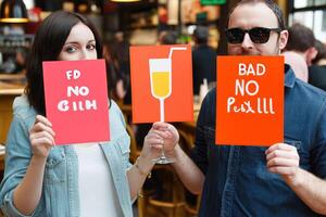 Couple holding signs with funny slogans photo