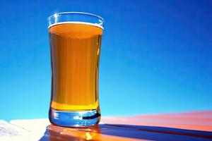 Refreshing glass of light beer on a sunny day photo