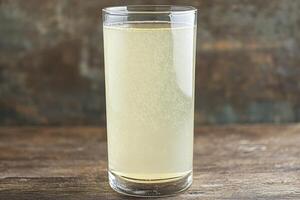 Refreshing, bubbly drink in a glass photo