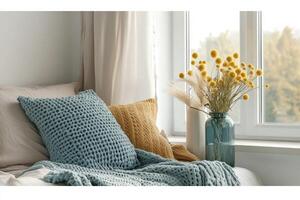 Cozy bedroom corner with soft textures and warm tones photo