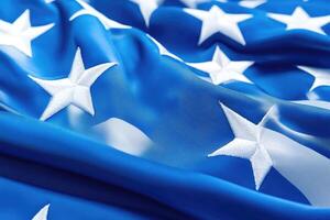 Close-up of an American flag. Rippled, flowing fabric, vibrant blue field, prominent white stars photo