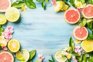 Fresh citrus fruits, vibrant colors, and tropical flowers arranged in a frame photo
