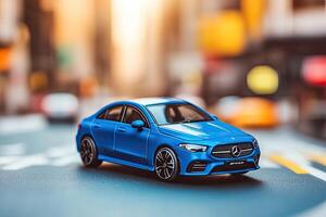 Blue miniature car model on city street photo