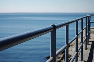 Ocean view from a metal railing photo