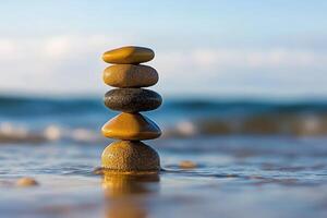 Balanced stones on beach photo