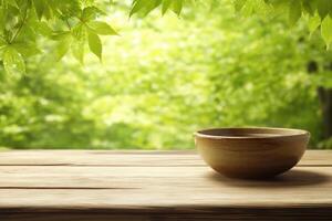 Tranquil bowl on wooden table, dappled sunlight filters through lush greenery photo