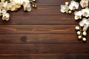 Elegant white orchids on dark wood photo