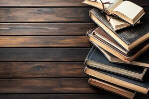 Stack of antique books on a wooden table photo