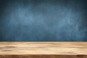 Empty wooden table in front of a textured dark blue wall photo