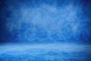 A vast, deep blue studio backdrop with textured walls and a smooth floor photo