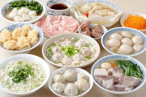 A variety of bowls of food including meat, vegetables and noodles photo