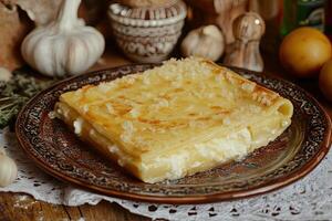 Baked cheese and dough dish photo