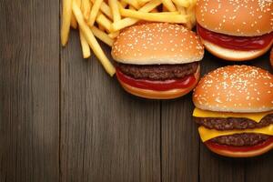 Gourmet burgers and fries on a wooden table photo
