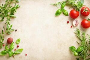 Fresh herbs and vegetables arranged on a textured surface photo