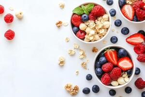 Healthy breakfast bowls with granola, berries, and nuts photo