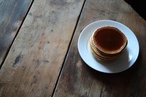 Stacked pancakes on a plate photo